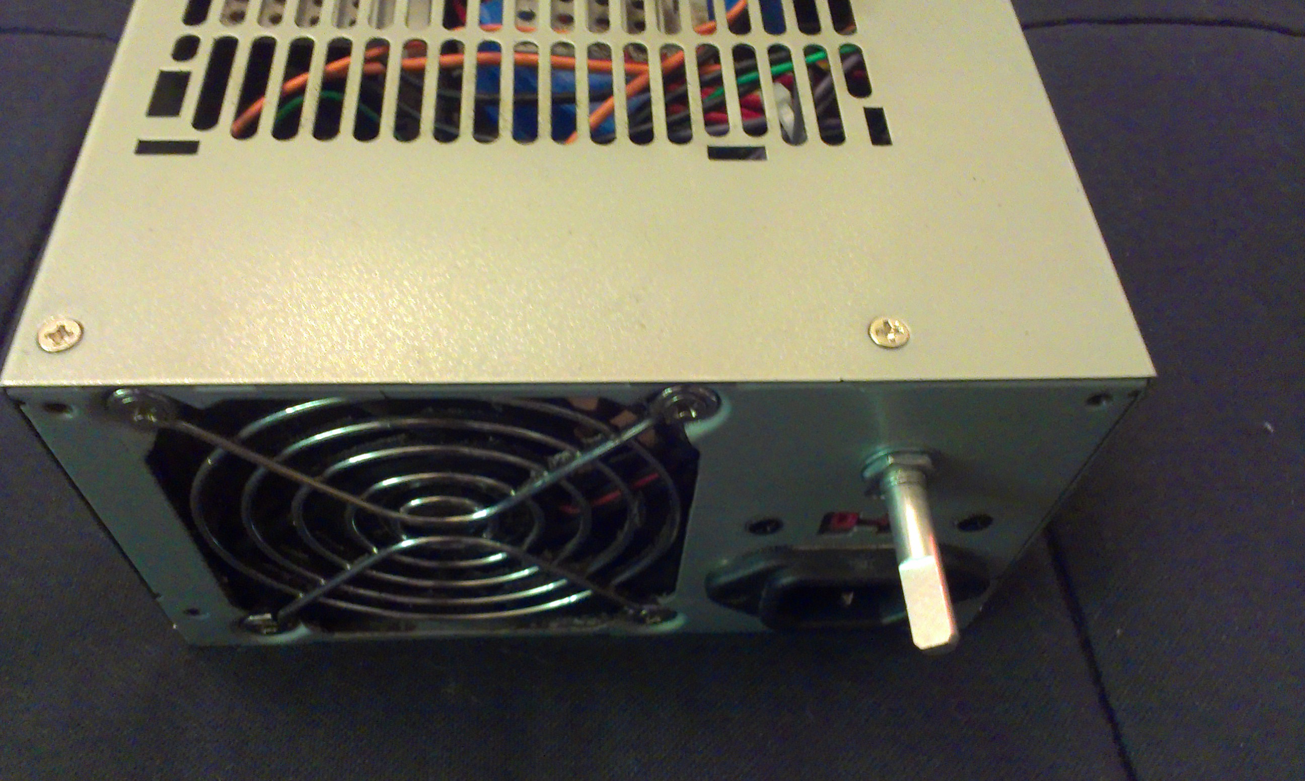 The back of the Hacked PSU with a potentiator for an on switch